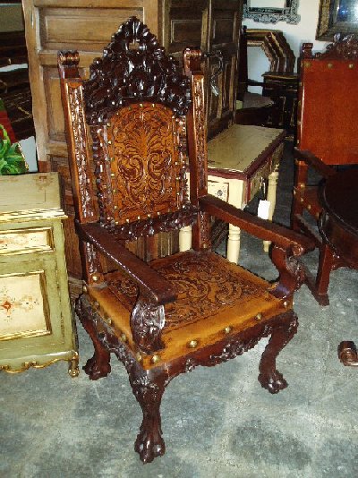 Isabellina Armchair with hand tooled leather, hand carved wood and chestnut finish, made in Peru